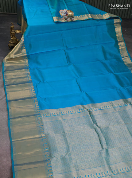 Pure kanchipuram silk saree dual shade of teal blue with plain body and long zari woven border