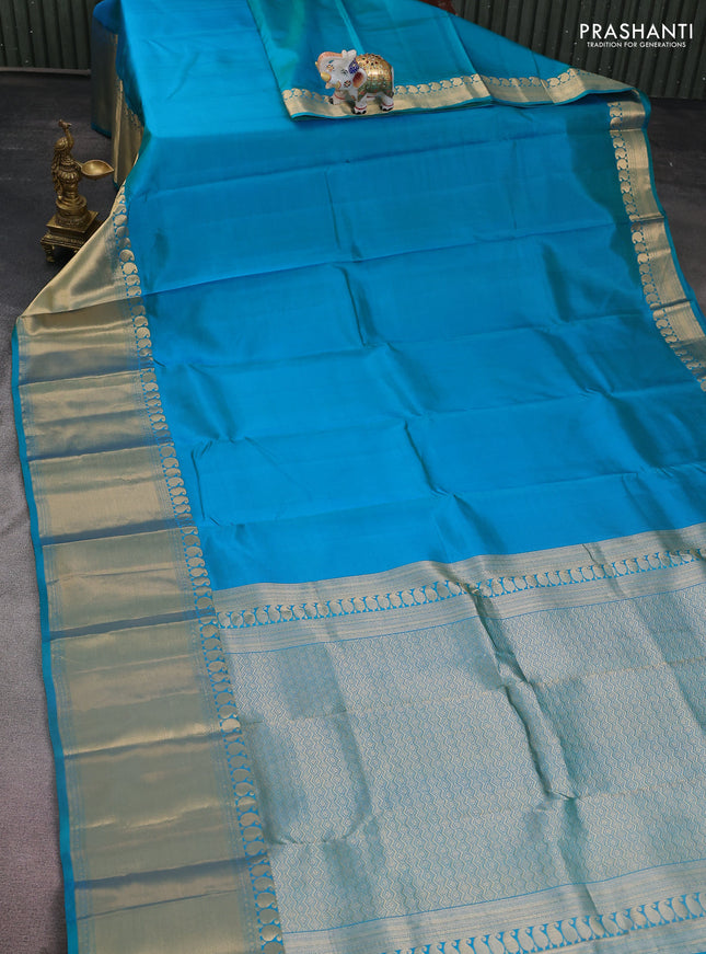 Pure kanchipuram silk saree dual shade of teal blue with plain body and long zari woven border