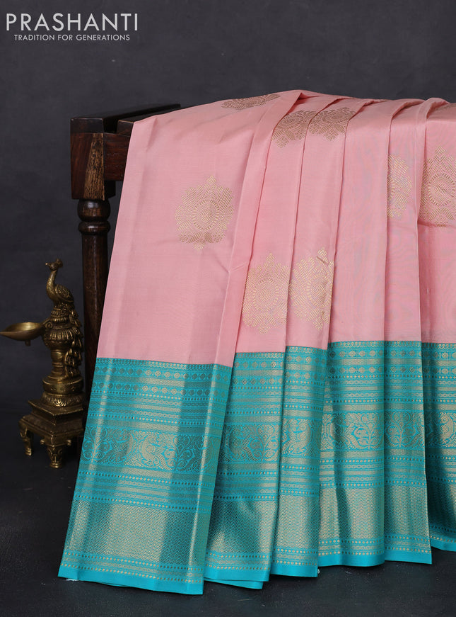 Pure kanchipuram silk saree pastel peach and teal blue with zari woven buttas and long zari woven korvai border