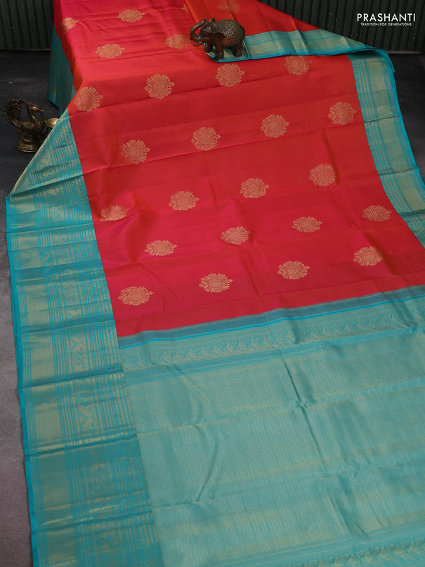 Pure kanchipuram silk saree dual shade of pinkish orange and teal blue with zari woven buttas and long zari woven korvai border