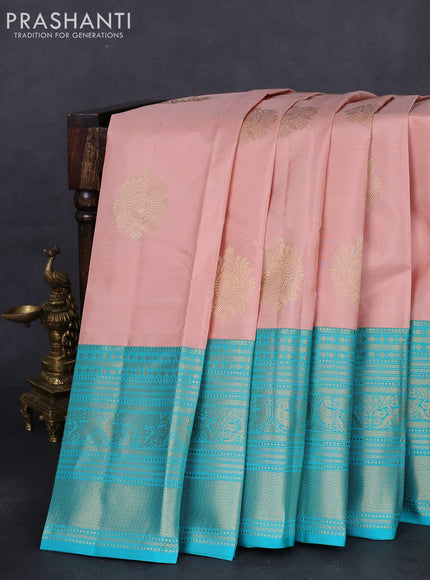Pure kanchipuram silk saree pastel peach and teal blue with zari woven buttas and long zari woven korvai border