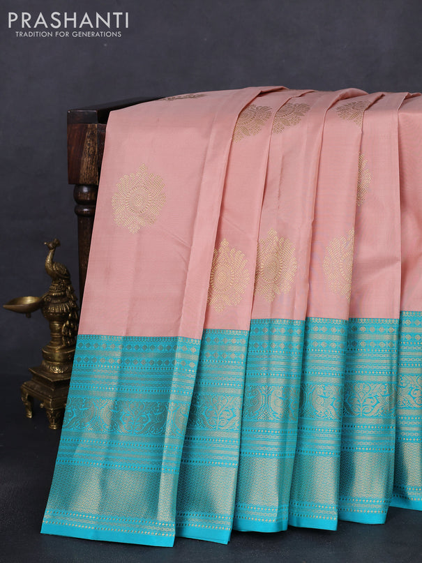 Pure kanchipuram silk saree pastel peach and teal blue with zari woven buttas and long zari woven korvai border