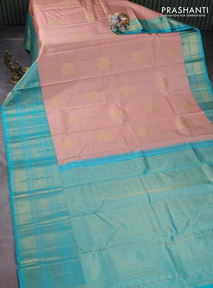 Pure kanchipuram silk saree pastel peach and teal blue with zari woven buttas and long zari woven korvai border