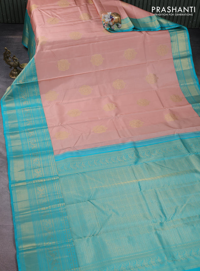 Pure kanchipuram silk saree pastel peach and teal blue with zari woven buttas and long zari woven korvai border