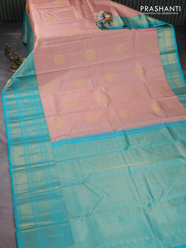Pure kanchipuram silk saree pastel peach and teal blue with zari woven buttas and long zari woven korvai border