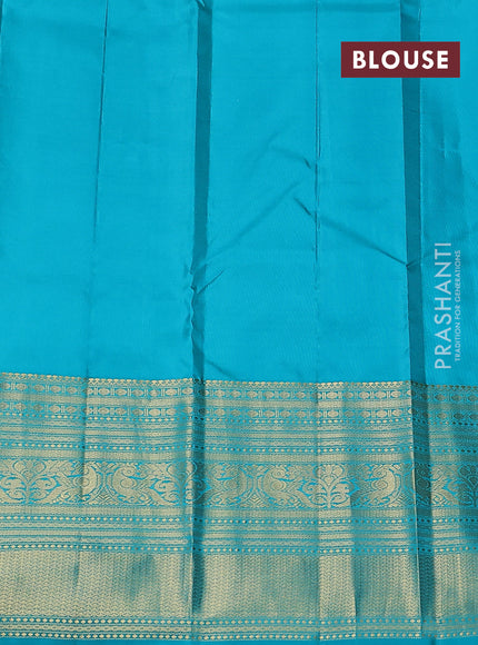 Pure kanchipuram silk saree pastel peach and teal blue with zari woven buttas and long zari woven korvai border