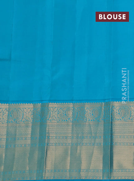 Pure kanchipuram silk saree cream and teal blue with paisley zari woven buttas and long annam zari woven korvai border
