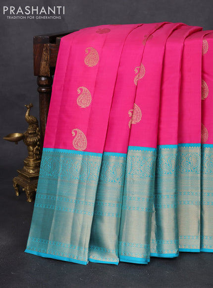 Pure kanchipuram silk saree candy pink and teal blue with paisley zari woven buttas and long annam zari woven korvai border