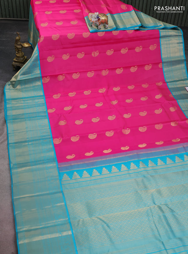 Pure kanchipuram silk saree candy pink and teal blue with paisley zari woven buttas and long annam zari woven korvai border