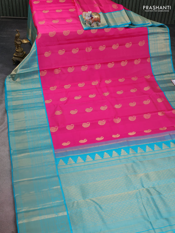 Pure kanchipuram silk saree candy pink and teal blue with paisley zari woven buttas and long annam zari woven korvai border