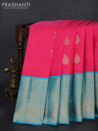 Pure kanchipuram silk saree candy pink and teal blue with paisley zari woven buttas and long annam zari woven korvai border