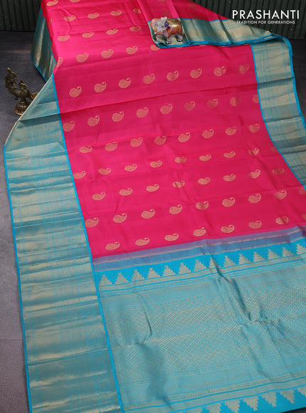 Pure kanchipuram silk saree candy pink and teal blue with paisley zari woven buttas and long annam zari woven korvai border