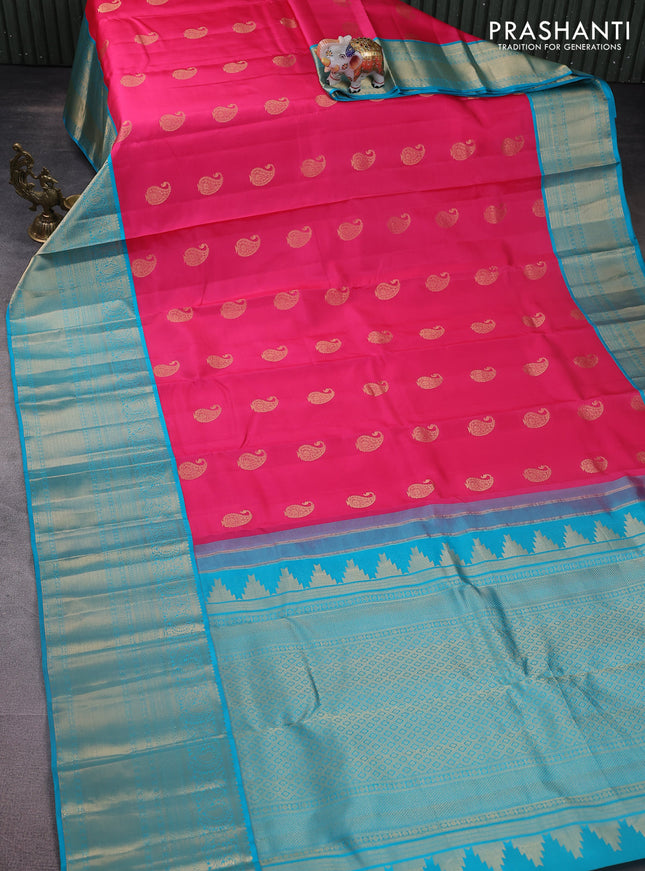 Pure kanchipuram silk saree candy pink and teal blue with paisley zari woven buttas and long annam zari woven korvai border