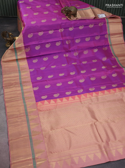 Pure kanchipuram silk saree purple and pastel peach with paisley zari woven buttas and long temple design zari woven korvai border