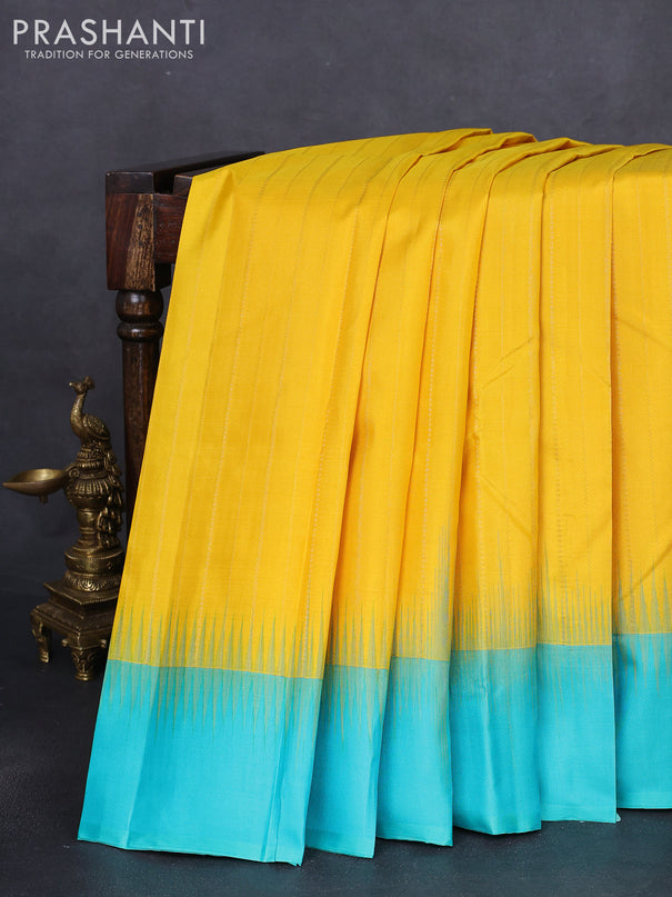 Pure kanchipuram silk saree yellow and teal blue with allover zari weaves and simple border