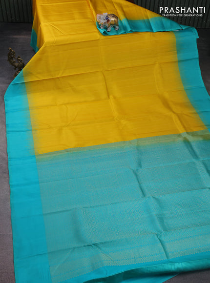 Pure kanchipuram silk saree yellow and teal blue with allover zari weaves and simple border