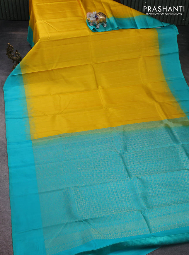 Pure kanchipuram silk saree yellow and teal blue with allover zari weaves and simple border