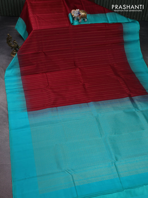 Pure kanchipuram silk saree maroon and teal blue with allover zari weaves and simple border
