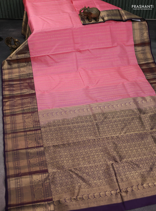 Pure kanchipuram silk saree peach pink and wine shade with allover zari weaves and long zari woven korvai border