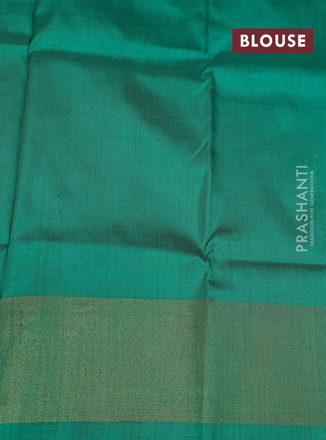 Ikat silk kids lehenga grey and teal green with allover ikat butta weaves and long ikat woven zari border