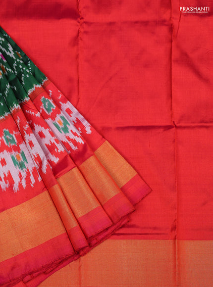 Ikat silk kids lehenga green and pinkish orange with allover ikat weaves and long ikat woven zari border
