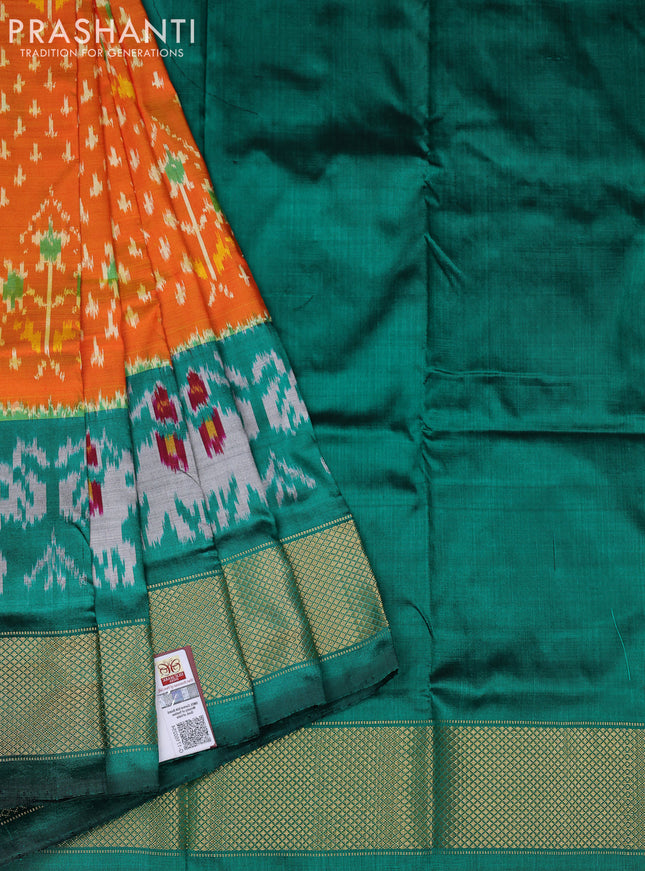 Ikat silk kids lehenga orange and teal green with allover ikat weaves and long ikat woven zari border