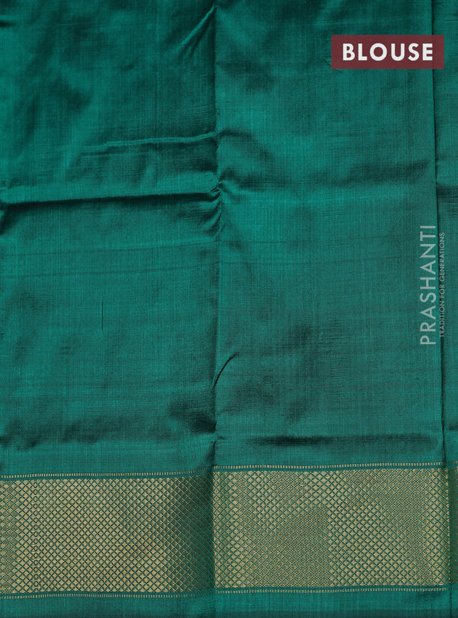 Ikat silk kids lehenga orange and teal green with allover ikat weaves and long ikat woven zari border