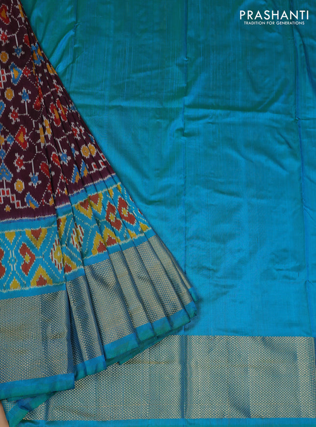 Ikat silk kids lehenga deep wine shade and teal blue with allover ikat weaves and long ikat woven zari border