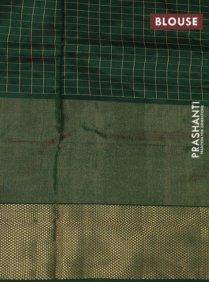 Ikat silk kids lehenga pink shade and green with allover zari checks & ikat weaves and long ikat woven zari border