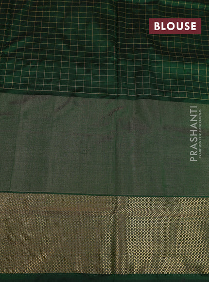 Ikat silk kids lehenga pink and dark green with allover zari checks & ikat weaves and long ikat woven zari border