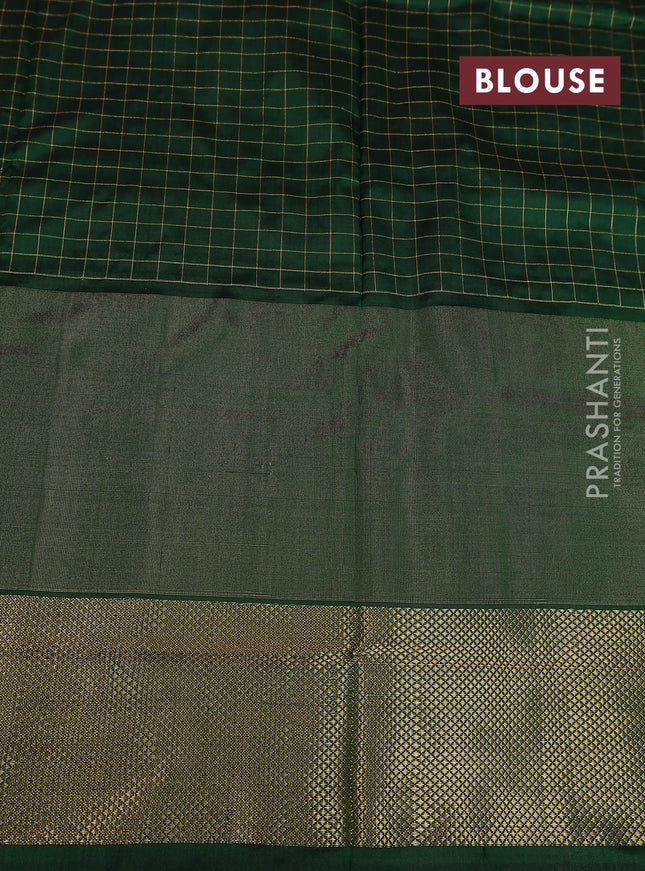 Ikat silk kids lehenga pink and dark green with allover zari checks & ikat weaves and long ikat woven zari border