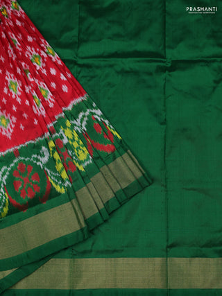 Ikat silk kids lehenga red and green with allover ikat weaves and long ikat woven zari border