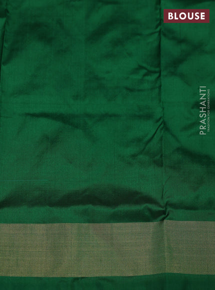 Ikat silk kids lehenga red and green with allover ikat weaves and long ikat woven zari border