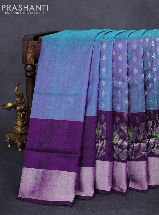 Pure uppada silk saree dual shade of blue and deep purple with allover silver zari woven buttas and floral design silver zari woven border