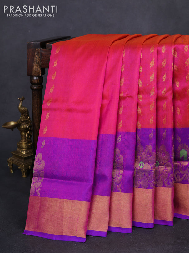 Pure uppada silk saree dual shade of pinkish orange and blue with allover zari woven leaf buttas and floral design zari woven border