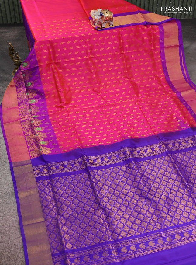 Pure uppada silk saree dual shade of pinkish orange and blue with allover zari woven leaf buttas and floral design zari woven border