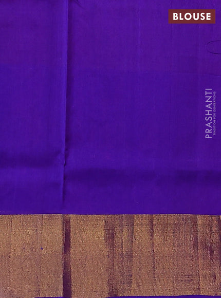 Pure uppada silk saree dual shade of pinkish orange and blue with allover zari woven leaf buttas and floral design zari woven border