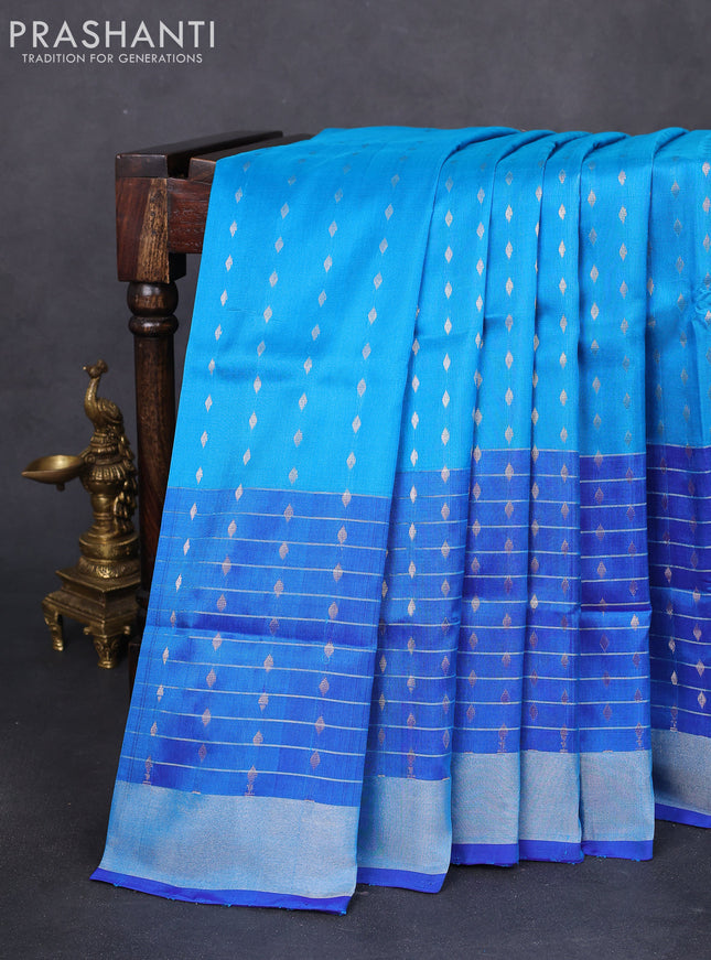 Pure uppada silk saree cs blue and blue with allover silver zari buttas and long silver zari woven border