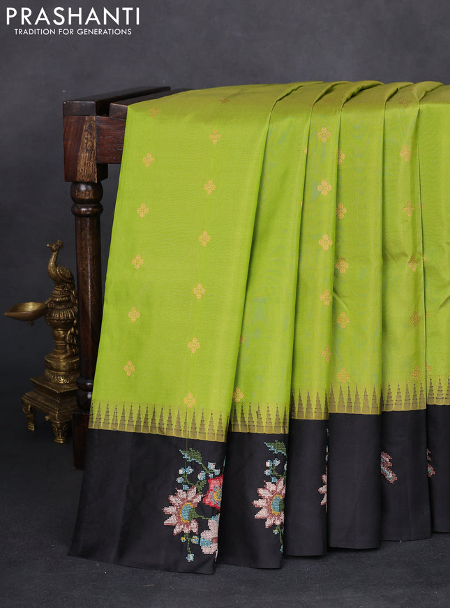 Pure gadwal silk saree light green and black with zari woven buttas and temple design embroidery border