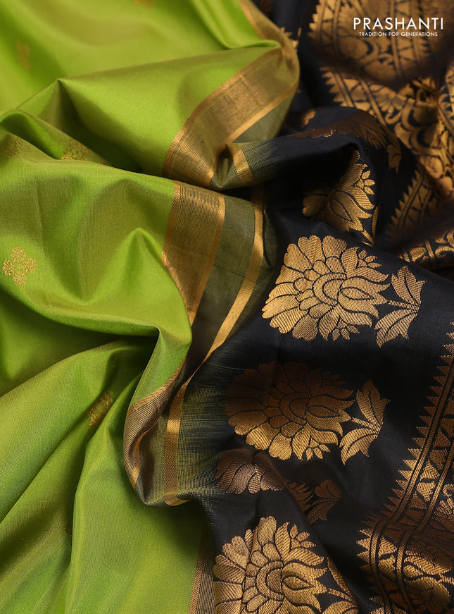 Pure gadwal silk saree light green and black with zari woven buttas and temple design embroidery border