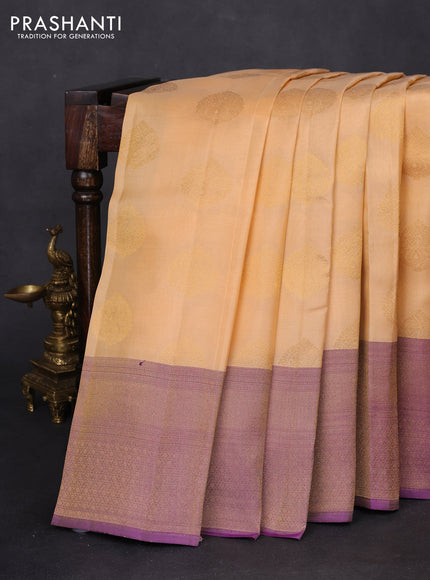 Kanchipuram silk saree sandal and dual shade of purple wuith zari woven buttas and long zari woven border