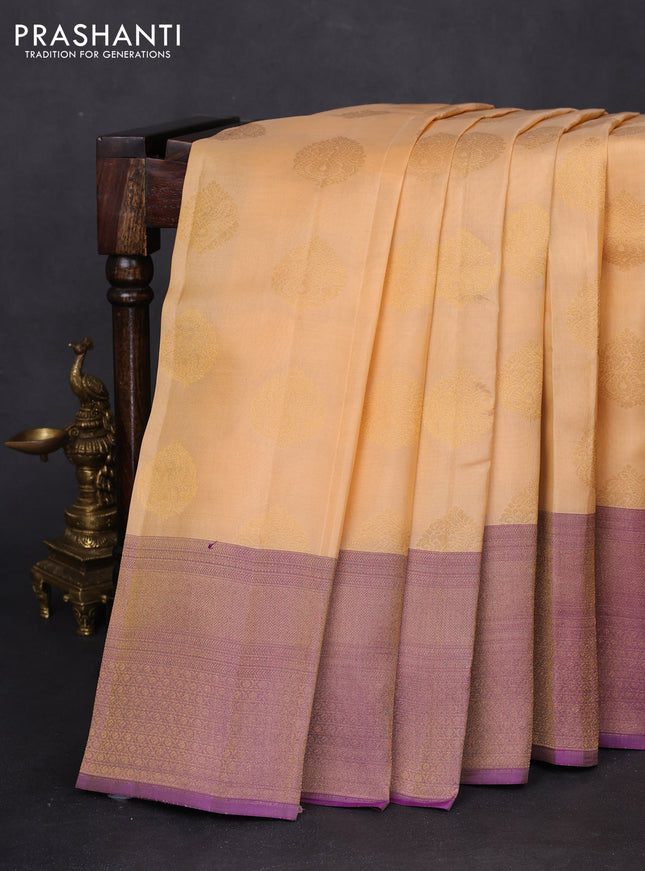 Kanchipuram silk saree sandal and dual shade of purple wuith zari woven buttas and long zari woven border
