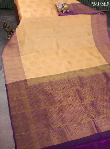 Kanchipuram silk saree sandal and dual shade of purple wuith zari woven buttas and long zari woven border