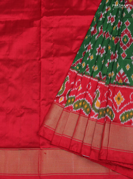 Ikat silk kids lehenga green and red with allover ikat weaves and long ikat woven zari border
