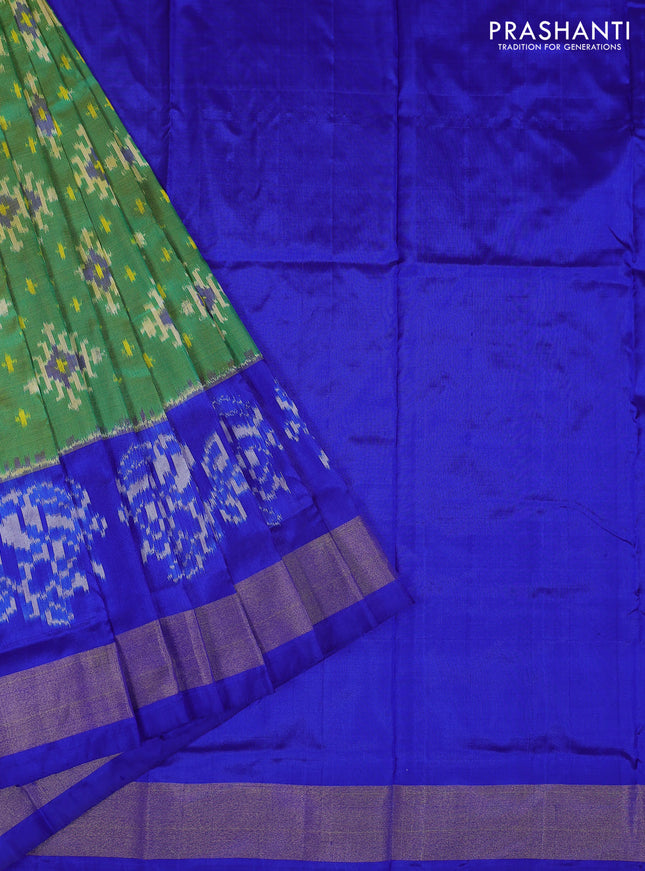 Ikat silk kids lehenga green and blue with allover ikat weaves and long ikat woven zari border