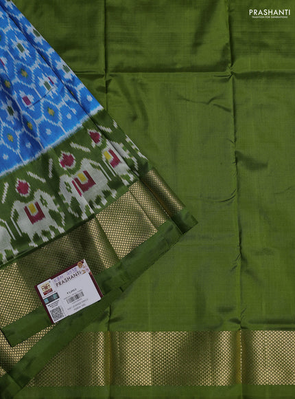 Ikat silk kids lehenga cs blue and light green with allover ikat weaves and long ikat woven zari border