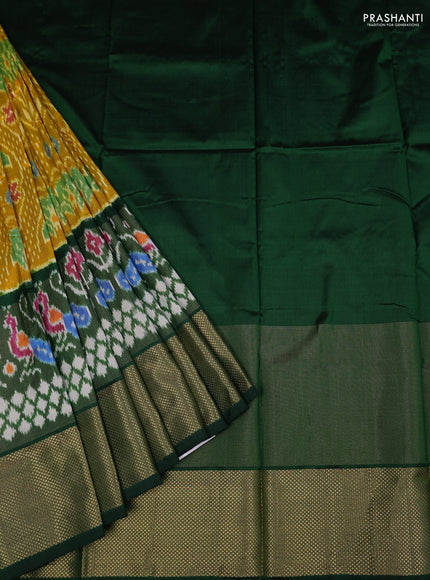 Ikat silk kids lehenga mustard yellow and green with allover ikat weaves and long ikat woven zari border