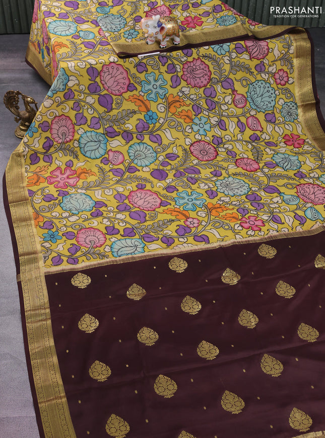 Pure mysore silk saree pale yellow and deep maroon with allover pen kalamkari prints and zari woven border
