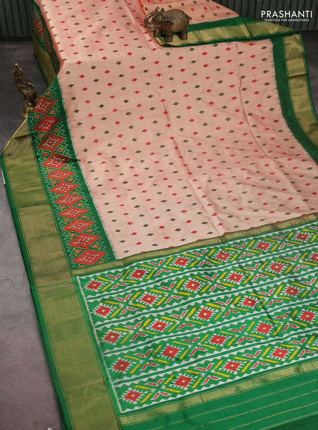 Pochampally silk saree dual shade of pale orange with allover ikat butta weaves and long ikat woven zari border
