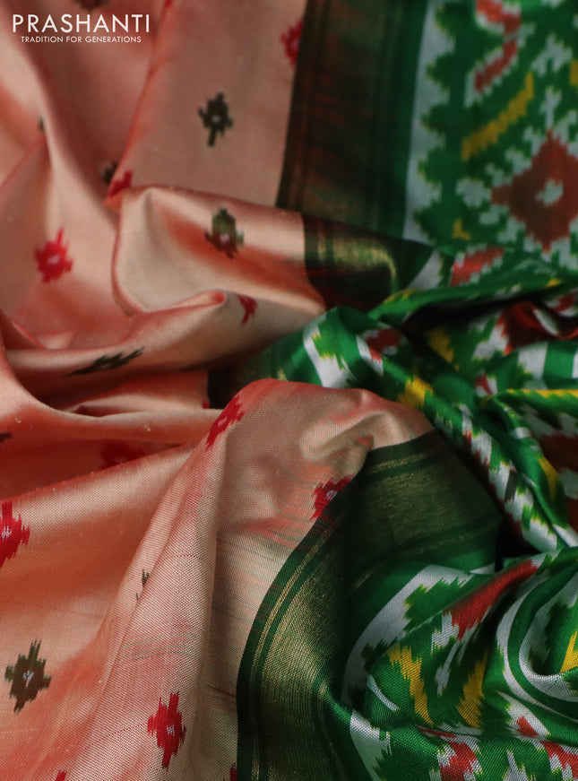 Pochampally silk saree dual shade of pale orange with allover ikat butta weaves and long ikat woven zari border